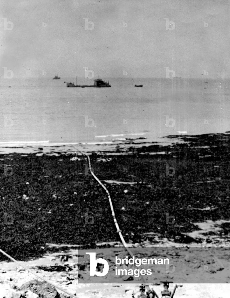 WWII:Plage de Normandy (France) June 1944 - Operation PLUTO: An underwater pipe line connects tankers anchors offshore to the petrol distribution plant