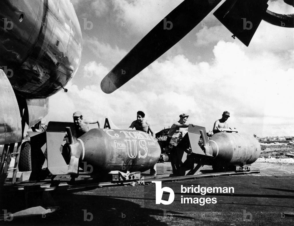 World War II (WWII) (1939-1945) - World War II (WWII or WW2): Saipan (Mariana Islands) Aug 3, 1945: Using rails recovered in sugar factories, these “crawlers” from the 20 USAF Bombardment Wing load 4000 pounds (1800 kgs) bombs into the bunkers of a B29 Superfortress