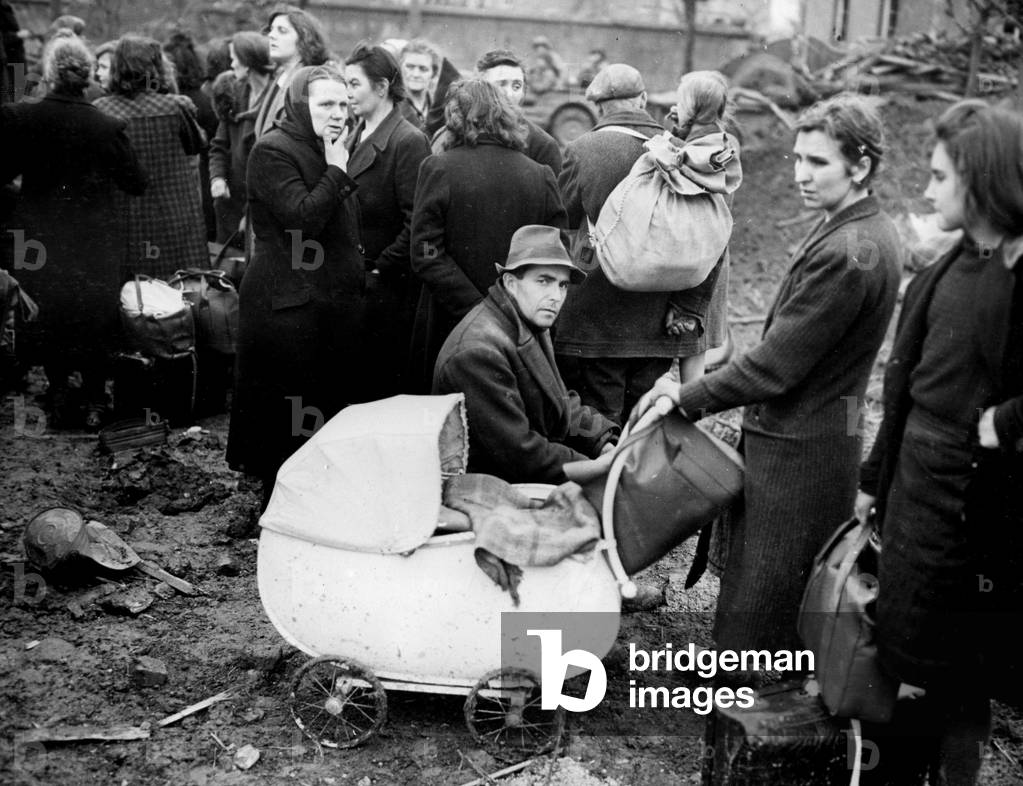 Second World War (1939-1945): Erkelenz (Germany) 28 February 1945: After their arrest following the capture of the city by infantrymen of the 9th US Army, these civilians are waiting to be registered by the authorities of the Allie Military Government.