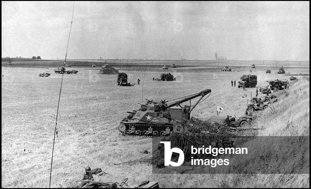 Second World War (1939-1945): elements of the 5th US DB gather in a field after the liberation of the city of Chartres, whose cathedral can be seen in the centre. Photograph taken about August 19, 1944.