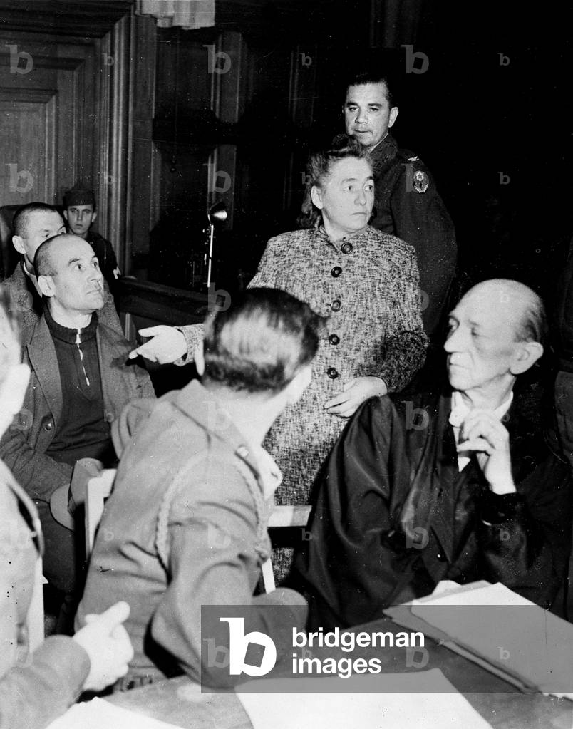 WWII:Wiesbaden (Germany) October 9, 1945: Before the court of the American Military Commission on War Crimes where seven employees of the Sanatorium of Hadamar, the first witness of the prosecution, a former nurse of the establishment, Nina Zachov designs one of the charges Heinrich Ruoff, former chief nurse for practicing lethal injections on Polish and sovietic detenuses