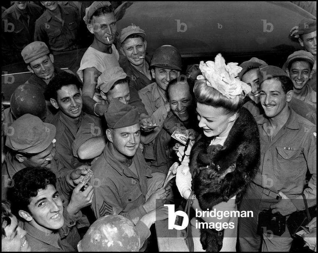 WWII:Near Reims (France) August 1945: After her show, American singer and actress Betty Hutton signs autographs at the GI's stationery at Camp Brooklyn