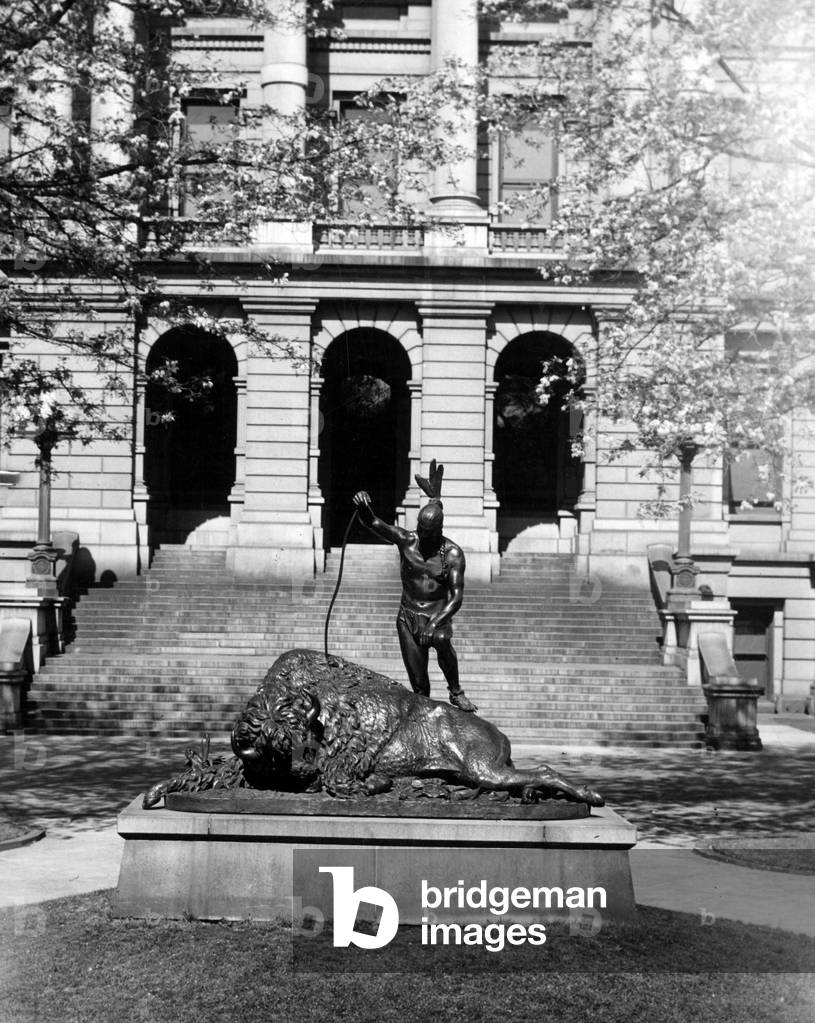 Denver (Colorado), USA, July 1929: “” The Closing of an Era”” (1892), sculpture by Preston Powers (1842-1904) depicting an Indian triumphant over a bison and located in front of the State Capitol of Colorado - Denver, Colorado, USA, July 1929: “” The Closing of an Era” (1892), Statue of an American Indian in triumph over a fallen bison by Preston Powers (1842- 1904), located on the east side of the state capitol building