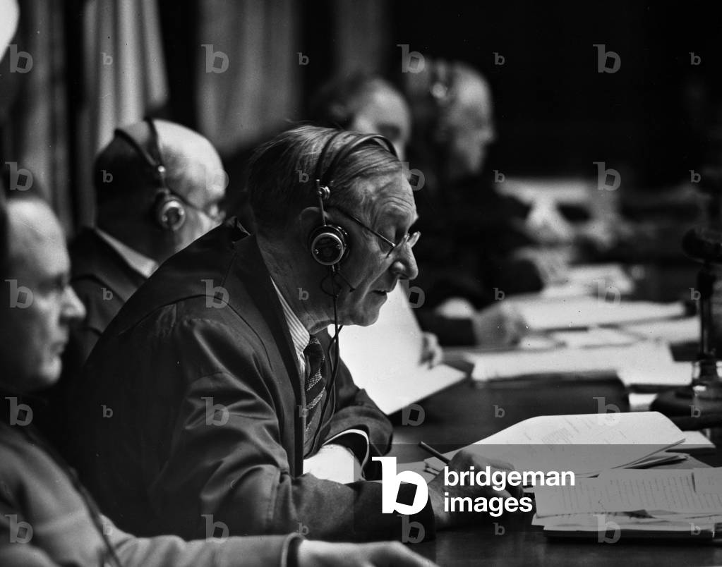 WWII:Nuremberg (Germany) 2 March 1946: At a hearing of the International Tribunal (IMT), the British Judge Justice Birkett takes notes.