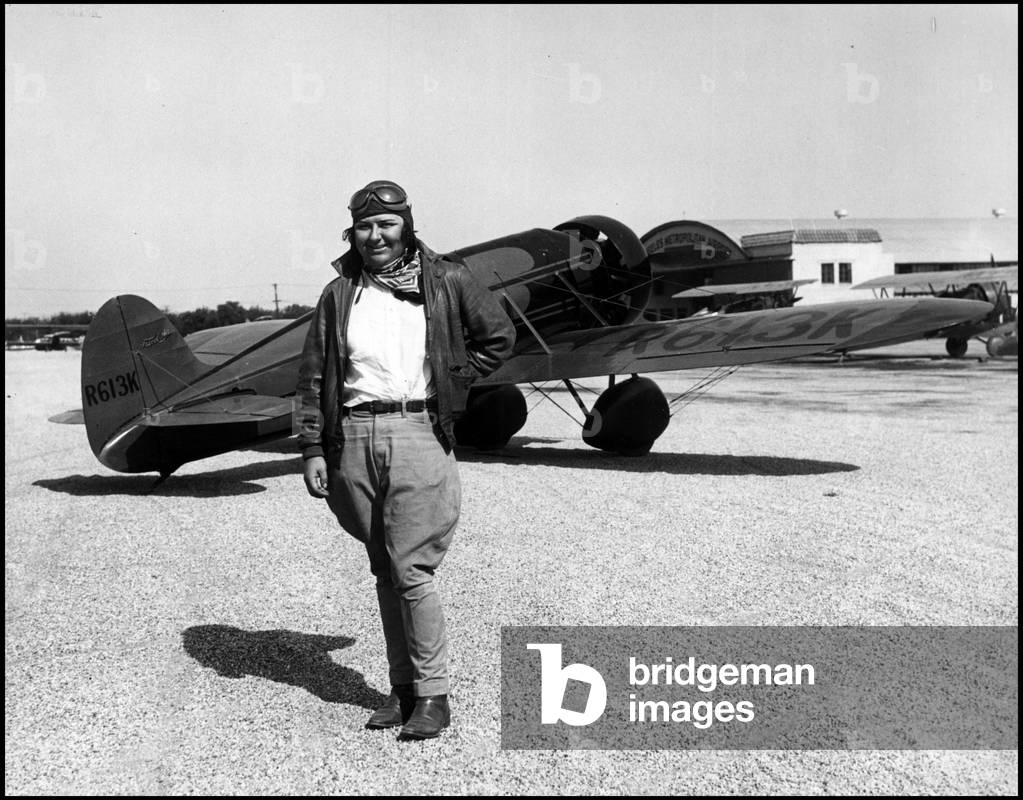 Los Angeles, California USA around 1930: Aviator Florence Lowe Barnes in front of her Travel Air Mystery Ship R613K aircraft with which she will try to beat the women's world record