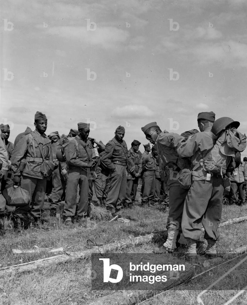 WWII:Near Suippes (Marne) France June 10, 1945: At Camp Boston where American soldiers waiting to return to the United States or redeploy to the Pacific theatre of operations, these members of a transport section of the 652nd Ordnance Ammo Co come from get to the camp. This company is made up of African Americans