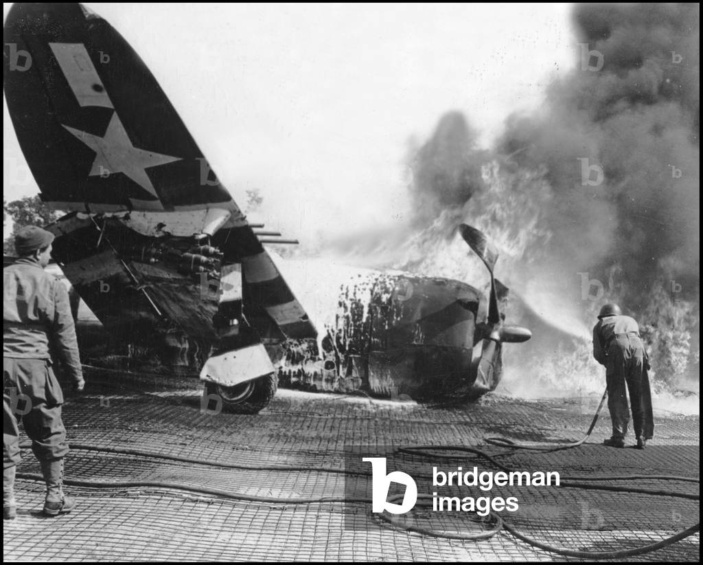 Second World War (1939-1945): Near Sainte-Mere-Eglise (Sainte Mere Eglise) (Manche) France 21 June 1944. A P-47 (P47) Republic Thunderbolt of the 9th USAF flames at the La Londe field airfield after crashing there. This aerodrome was used until July 26, 1944. Photography