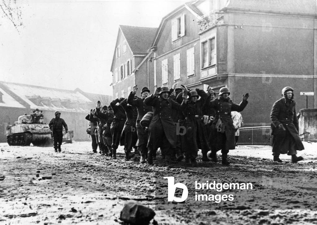 WWII:Colmar (France) 2 February 1945: During the liberation of the city, soldiers of the 5th DB of the 1st French Armee escort a group of German soldiers who have just surrendered