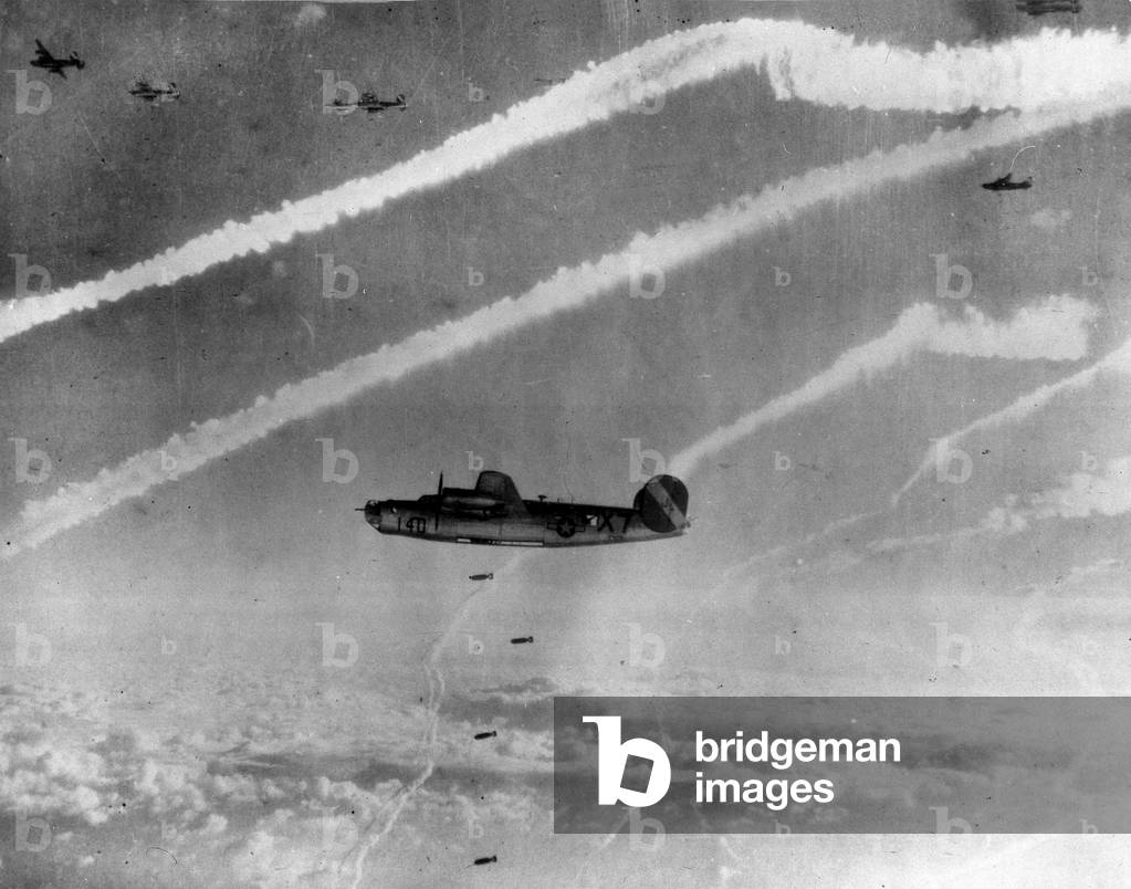 WWII:Hamburg, Germany 21 November 1944: Bombardment of the Rhenania-Ossag and Ebane refineries by liberators B24 of the 8th USAF. White traces are the condensation trails of the escort hunters