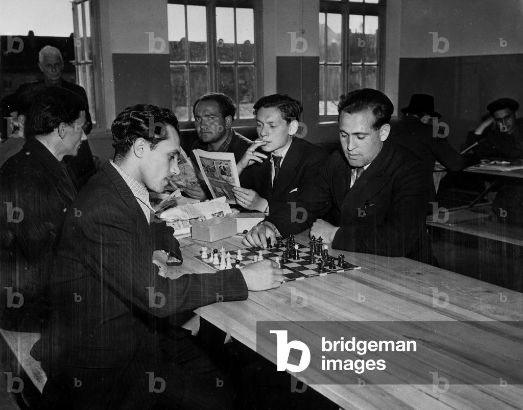 WWII:Breme (Germany) 1946: At the Centre de Regroupement des Immigrants, a former Jewish deportant Israel Katz (left) and a Czech deportant Vilky Sevlys play a game of chess. This centre comprises for many survivors of death and concentration camps or workers from Eastern Europe who are about to migrate to the United States.
