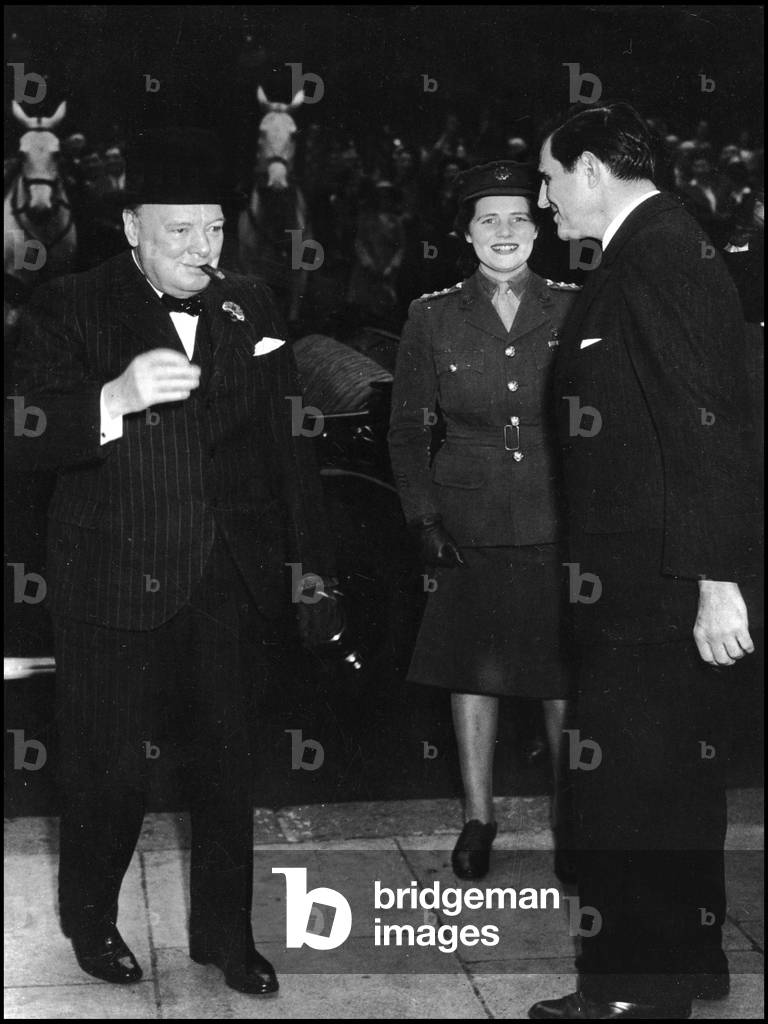 Second World War (1939-1945): London (England, Great Britain) May 9, 1945 - Prime Minister Winston Churchill (1874-1965) and his daughter are greeted by United States Ambassador John Winant (1889-1947) at the religious office