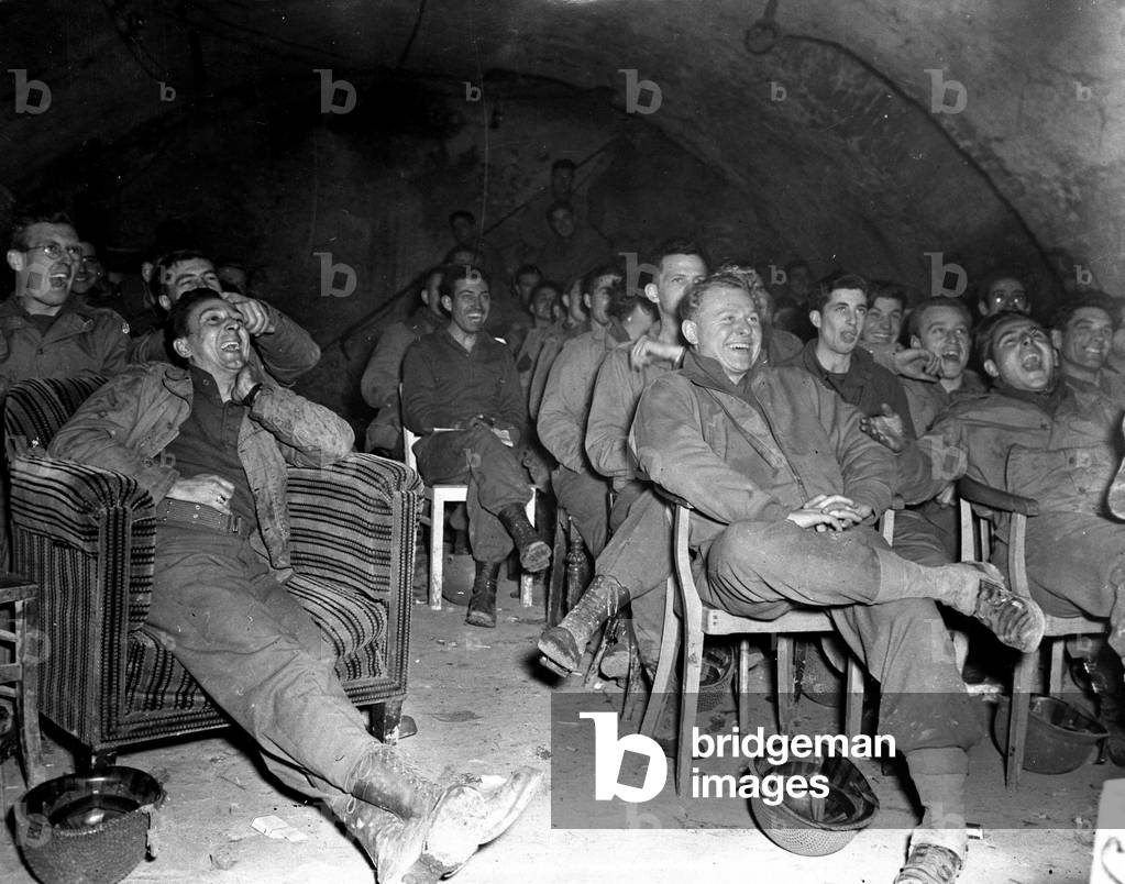 WWII:Herzogenrath (north of Aachen) Germany at the end of December 1944: Soldiers of the 1st US Army enjoy a moment of relaxation during the screening of a film
