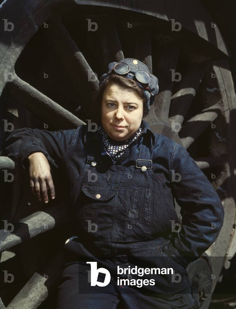 Women employed as a wiper at a railroad roundhouse during World War 2, Clinton, Iowa, April 1943