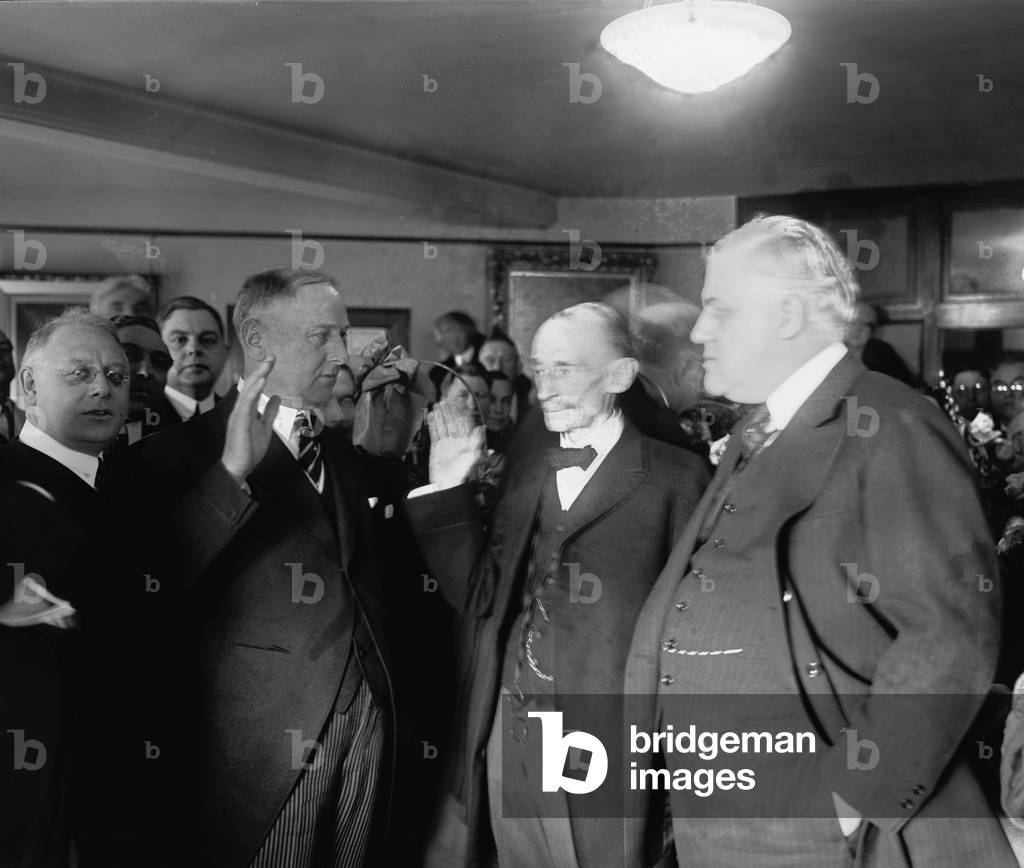 Harry M. Daugherty (1860-1941 ), at left, being sworn in as Attorney General, the day following Warren G. Harding's inauguration, March 5, 1921