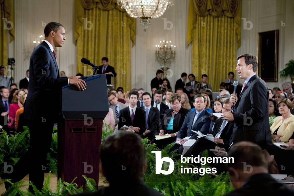 President Barack Obama listens to a question from ABC correspondent Jake Tapper during a prime time news conference in the East Room of the White House on July 22 2009.,