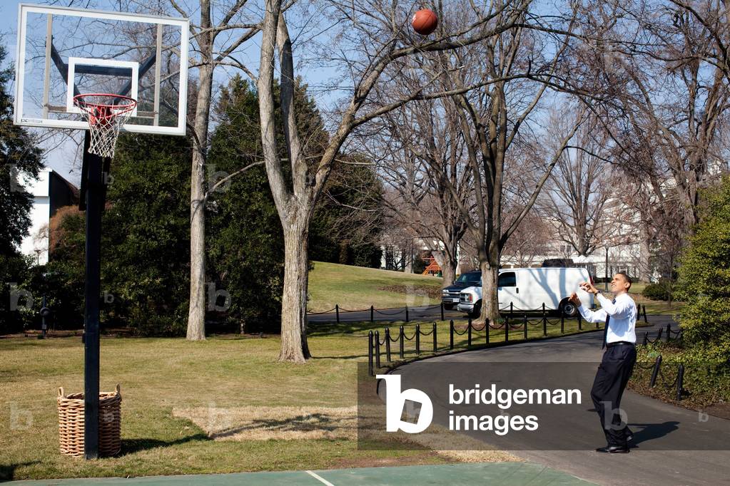 President Obama shoots hoops on the White House South Lawn basketball court March 6 2009.,