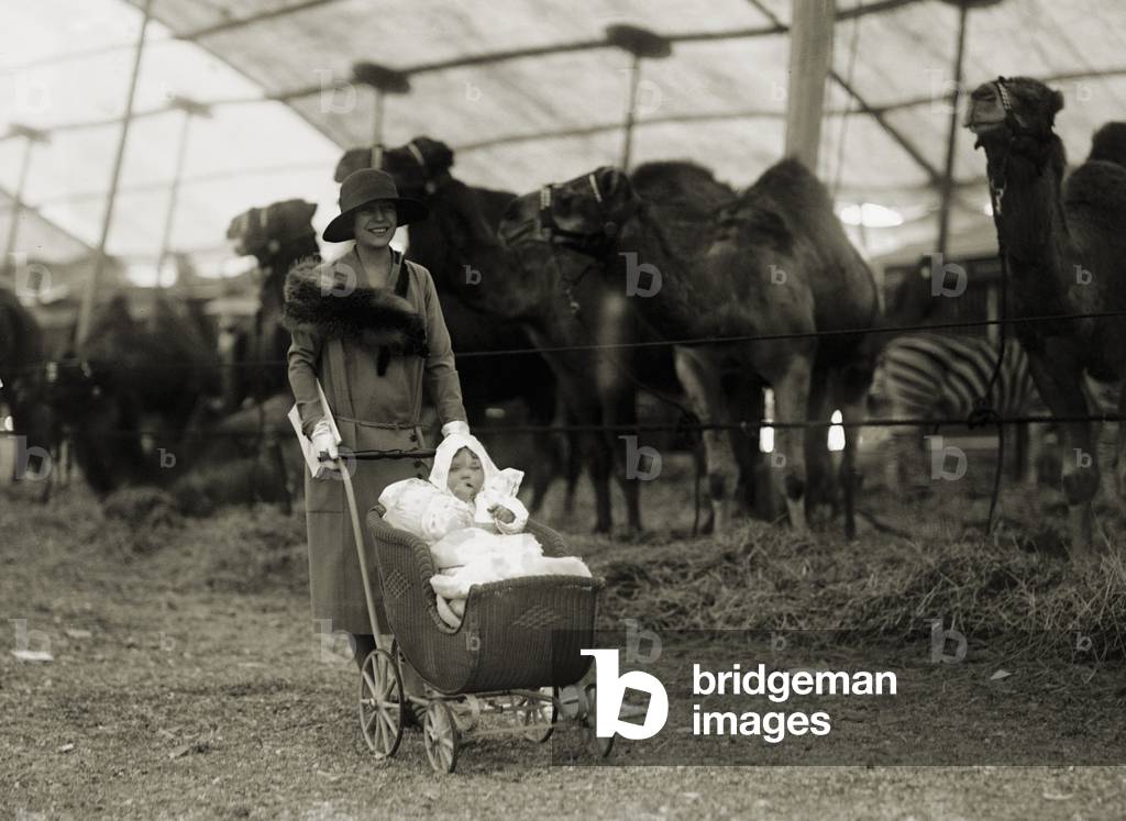 Alice Roosevelt Longworth with baby daughter Paulina at the circus, May 5, 1926