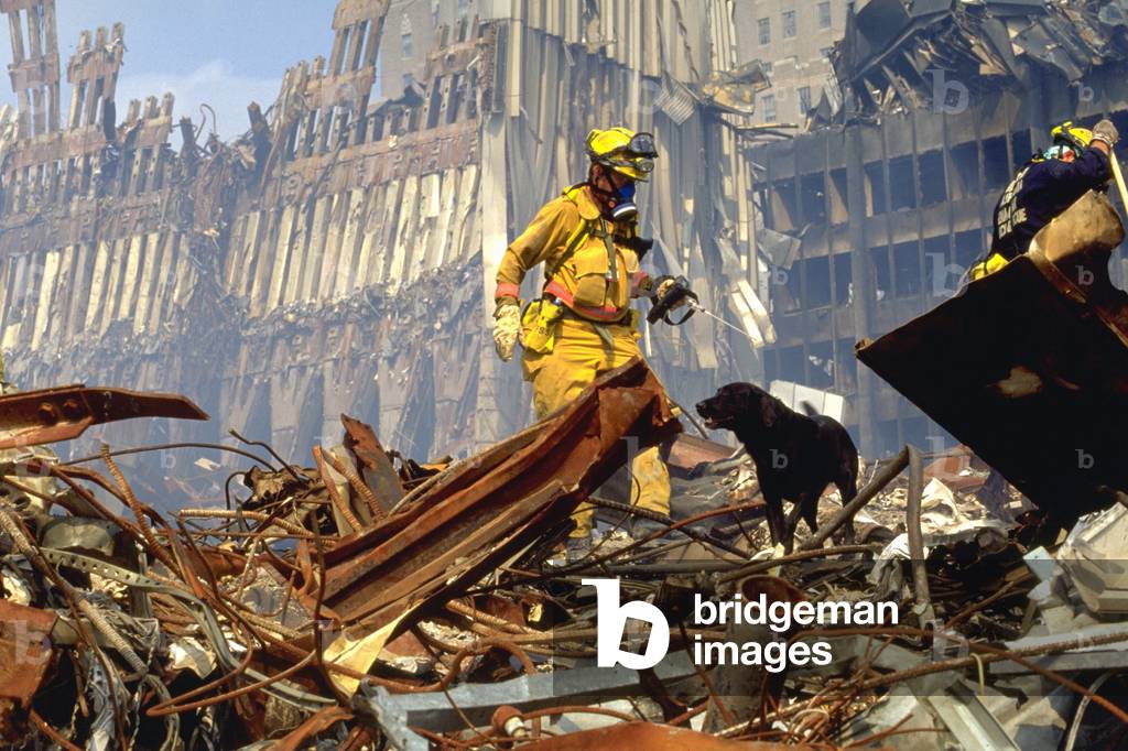 Search and rescue teams search for survivors amongst the wreckage of the World Trade Center. Sept. 20 2001