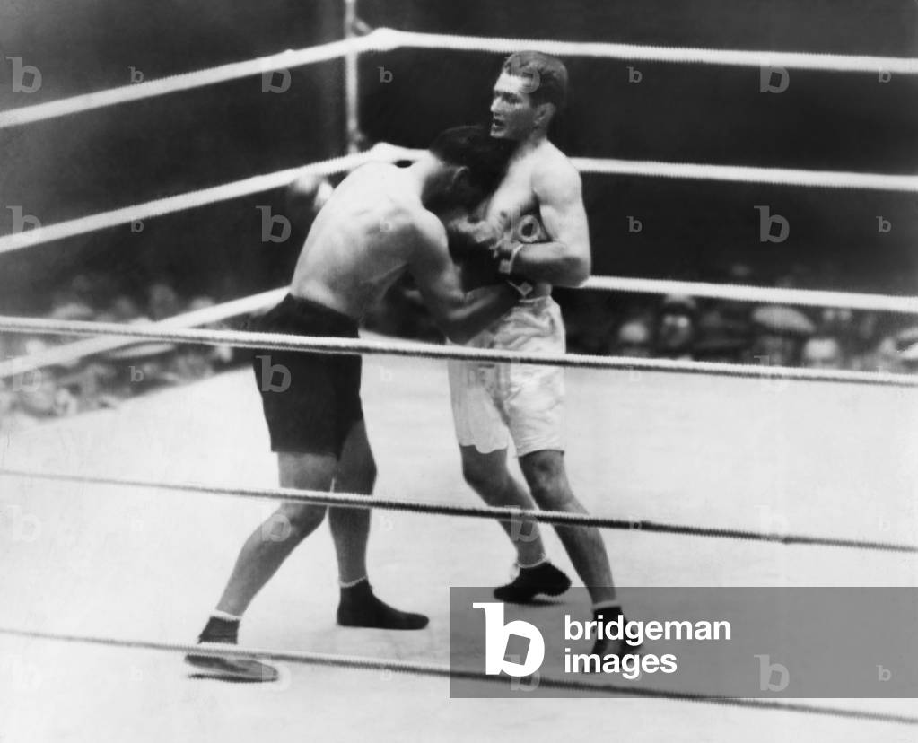 Gene Tunney-Jack Dempsey boxing match or the 'Long Count Fight' of Sept. 22, 1927. Dempsey (dark trunks) boring in during the second round. Tunney was defending his World Heavyweight title at Soldier Field, Chicago.