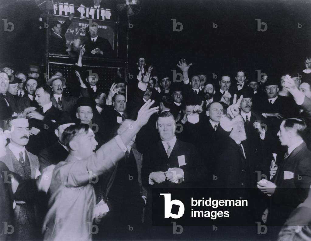 Traders in the Wheat pit of the Board of Trade in Chicago 1920. There were several octagonal pits named for the commodity traded including a Corn Pit Soybean Pot etc