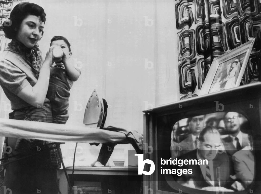 A New York City mother watches a televised Army McCarthy Hearing. In April 1954, the American public got a full view of Joseph McCarthy as Chairman of the Government Operations Committee in the Senate. Their reaction ended in his fall from public approval and a belated censure from the U.S. Senate in December 1954