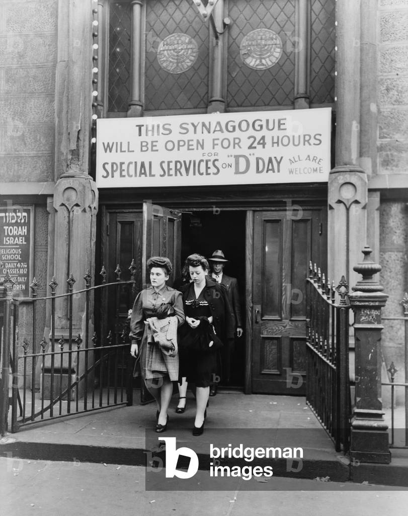 Wives and families of Jewish American GIs leave a New York City synagogue on West Twenty-third Street, which was open all day on D-Day, June 6, 1944. They awoke to the announcement that Allied troops were landing on the beaches of Normandy and prayed for the safety of their loved ones in military service