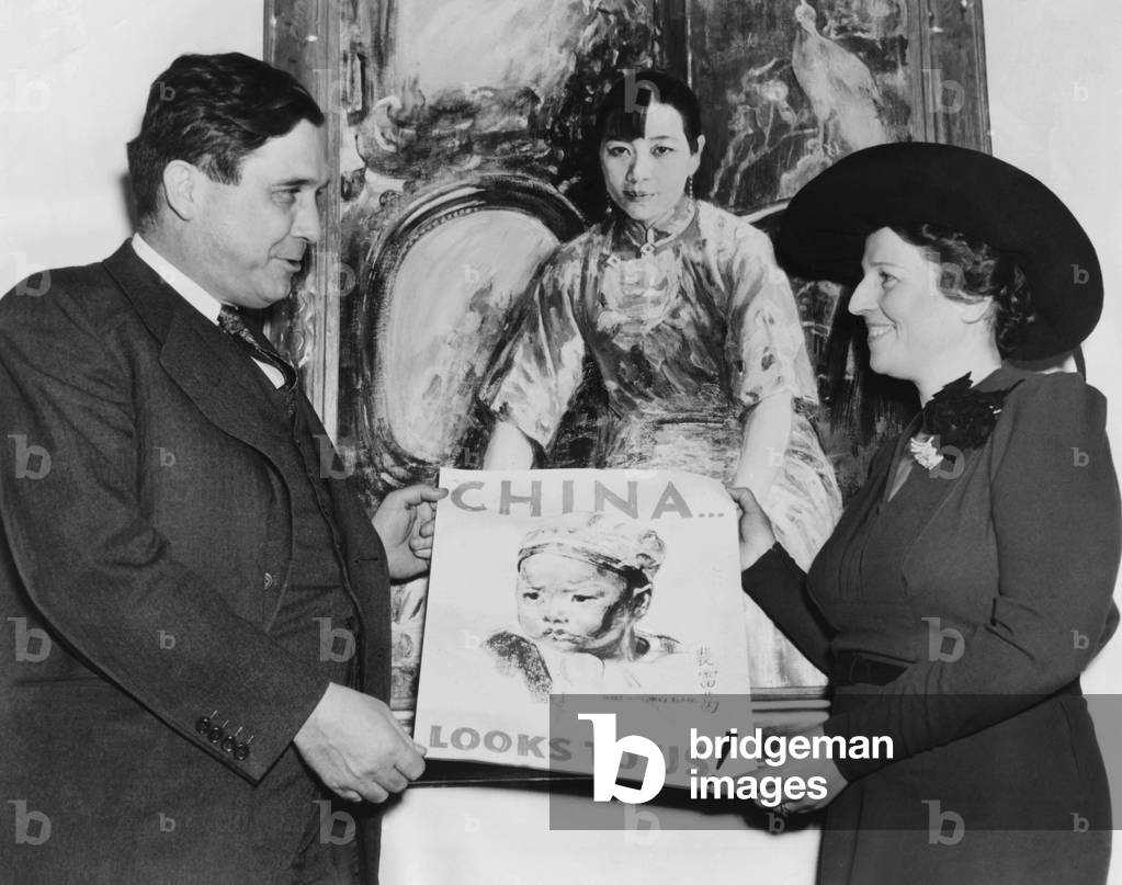 Wendell Willkie, Director of United China Relief with Pearl Buck. They present the poster to be used in a drive for  million for Chinese relief