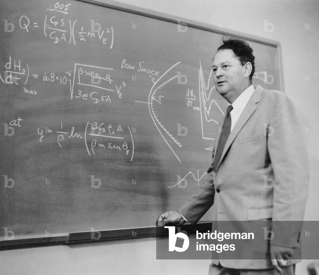 Harry Julian Allen (1910-1977), aeronautical engineer. On the blackboard is an illustration of his Blunt Body Theory used in the design of the heat shields that protected space capsules re-entered the Earth's atmosphere. Dec. 12, 1957