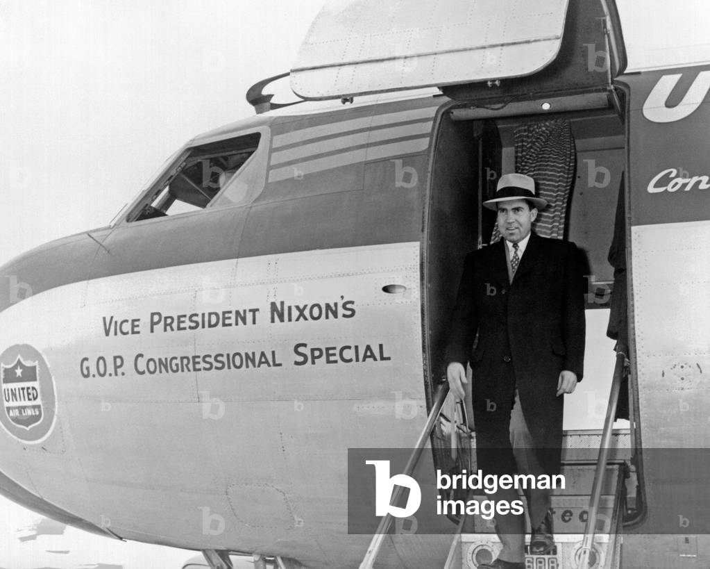 Vice President Richard Nixon exits his plane during the 1956 election campaign