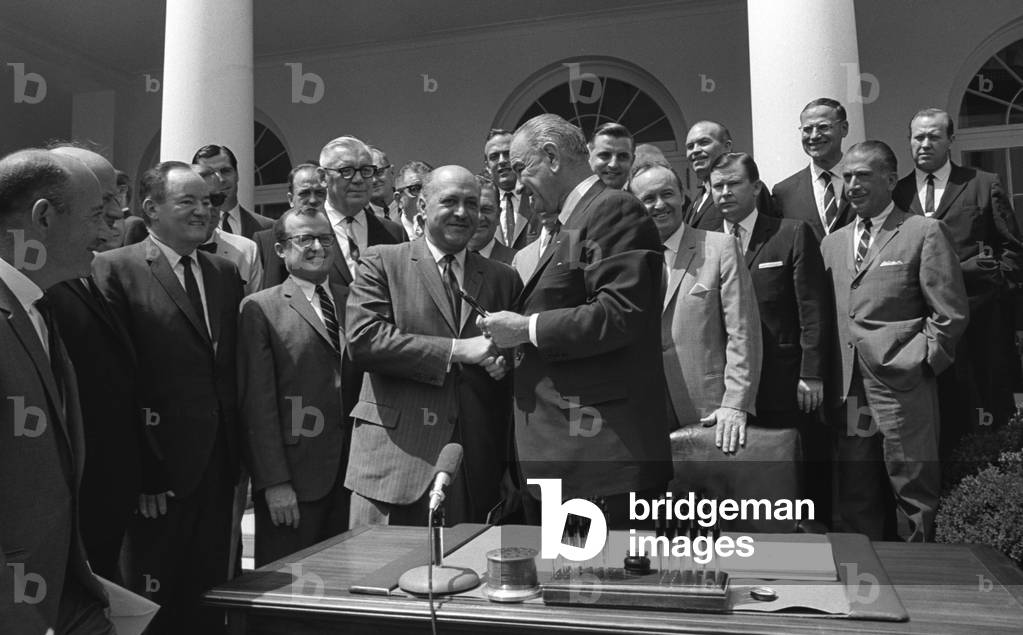 LBJ's Great Society programs. President Lyndon Johnson shakes HUD Secretary, Robert Weaver, after signing of the Housing and Urban Development Act. The legislation expanded federal housing programs, provided rent subsidies for the elderly and disabled; housing grants to poor homeowners; and provisions for veterans mortgages. Aug. 10, 1965