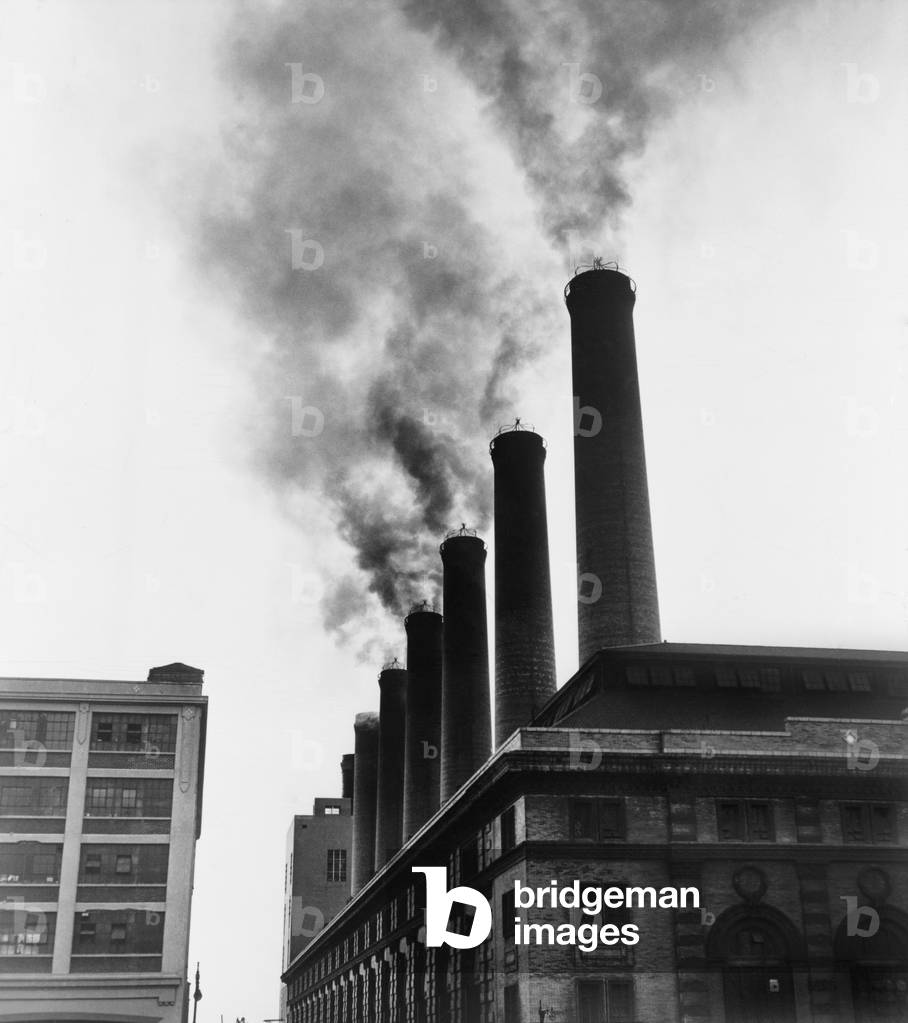 Smoke spewing from stacks of the New York City Board of Transportation plant in February 1951