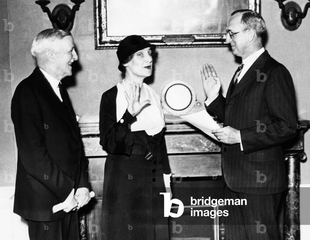 Nellie Tayloe Ross sworn in as Director of the Mint. May 3, 1933. R-L: Secretary of the Treasury Woodin, Mrs. Ross and F.A. Birgfeld, Chief Clerk of the Treasury Department. She was the former governor of Wyoming, the first female state governor in U.S. history.