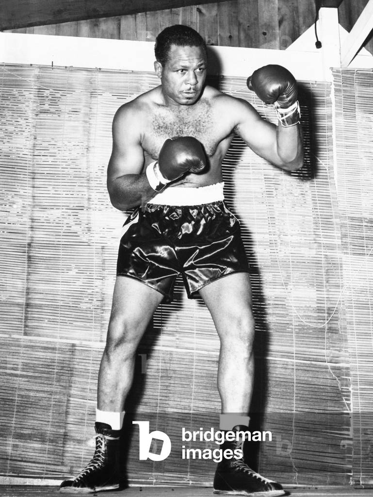 Archie Moore at Kenwood Camp, while training for his match with Rocky Marciano. Aug. 31, 1955. Moore, the light Heavyweight Champ unsuccessfully challenged Marciano's Heavyweight Title, in their Sept, 20, 1955 Yankee Stadium fight