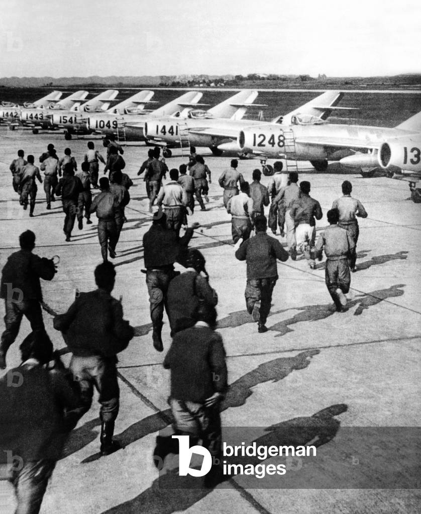 Red Chinese Army Mig Pilots rush to their planes during training at an unidentified air base in Red China. May 13, 1966