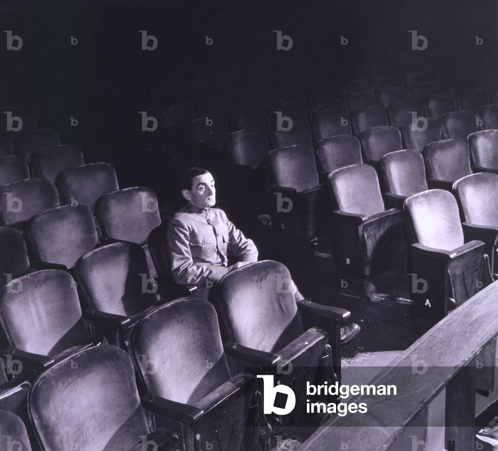 Irving Berlin (1888-1989), seated alone in auditorium in 1942. In addition to theatrical hits, Berlin's film credits include: TOP HAT, FOLLOW THE FLEET, EASTER PARADE, CALL ME MADAM, HOLIDAY INN, and ANNIE GET YOUR GUN