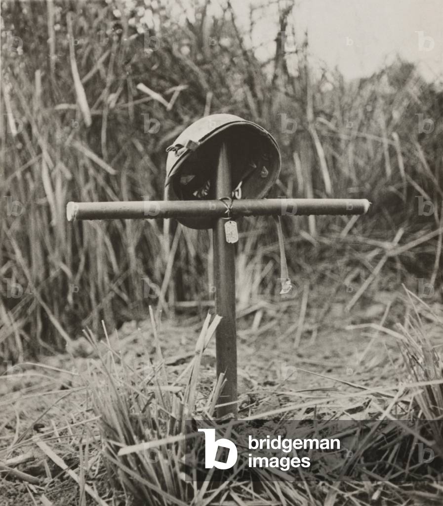Helmet and dog tags of Sgt. Lionel J. Paquette on a cross made from bamboo, in Burma (Myanmar). He was a World War II special forces soldier with Merrill's Marauders, who entered Burma in April 1944 with a force of 2,200. At the end of five months of fighting against the Japanese, wounds, disease and hunger reduced the original force to 130 fighting men