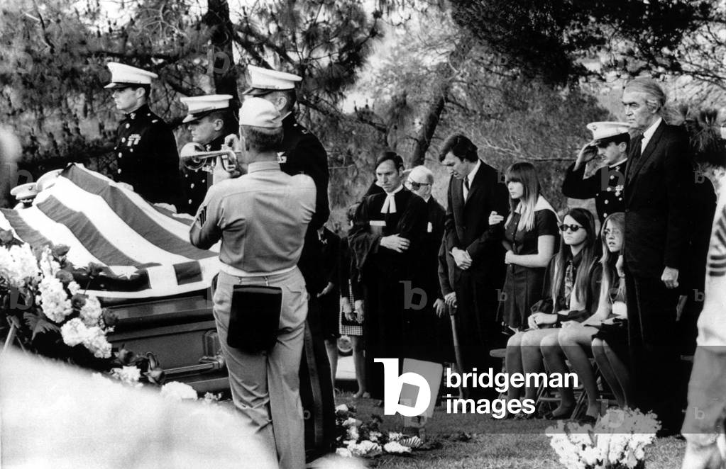 Military funeral for Ronald W. McLean, step-son of James Stewart (right). McLean was killed in the Vietnam War. Mourners include Brother Michael with his fiancee, and twin sisters Kelly and Judy. Mother Gloria Stewart is hidden behind Stewart. June 17, 1969