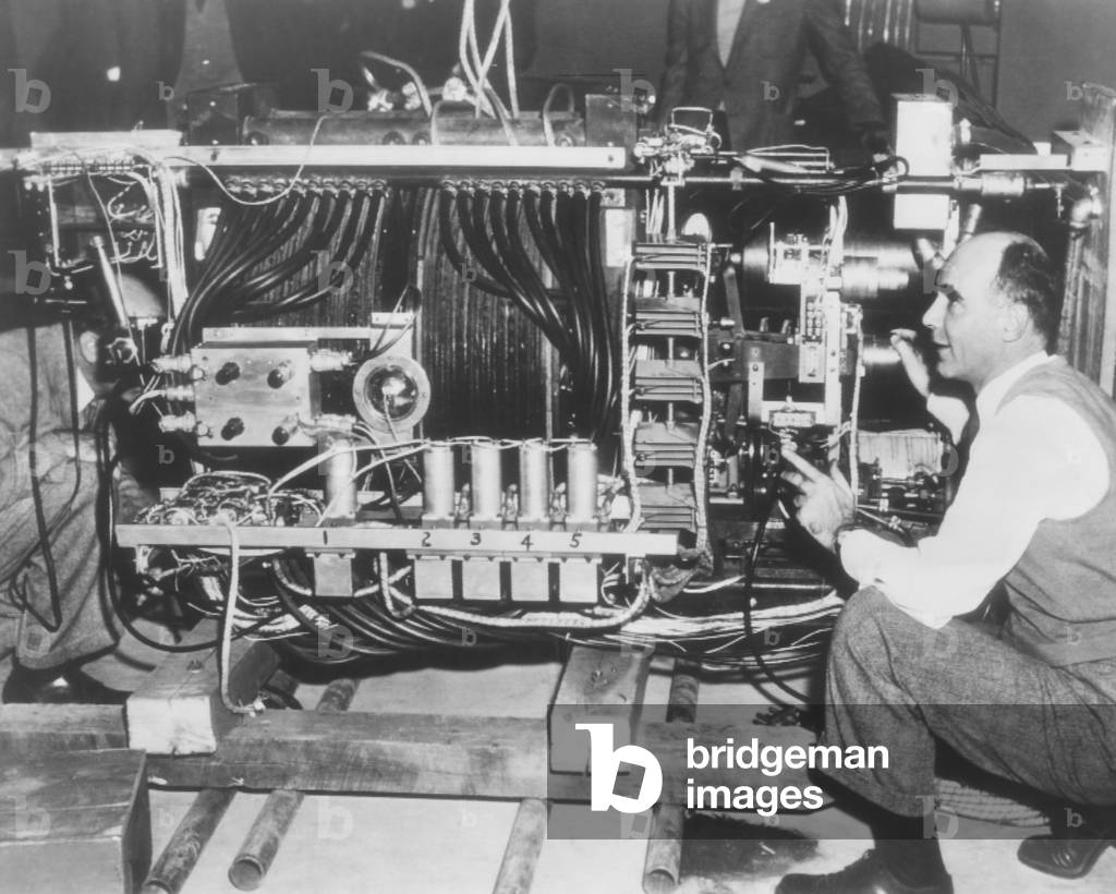 Dr. Carl Anderson shows newsmen his cloud chamber for cosmic ray research. Dec. 18, 1946. Inyokern, California, was the location of the U.S. Navy's Naval Air Weapons Station during World War II