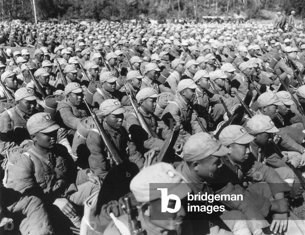 Chinese soldiers seated in rows equipped with rifles and fresh uniforms in 1945. World War 2