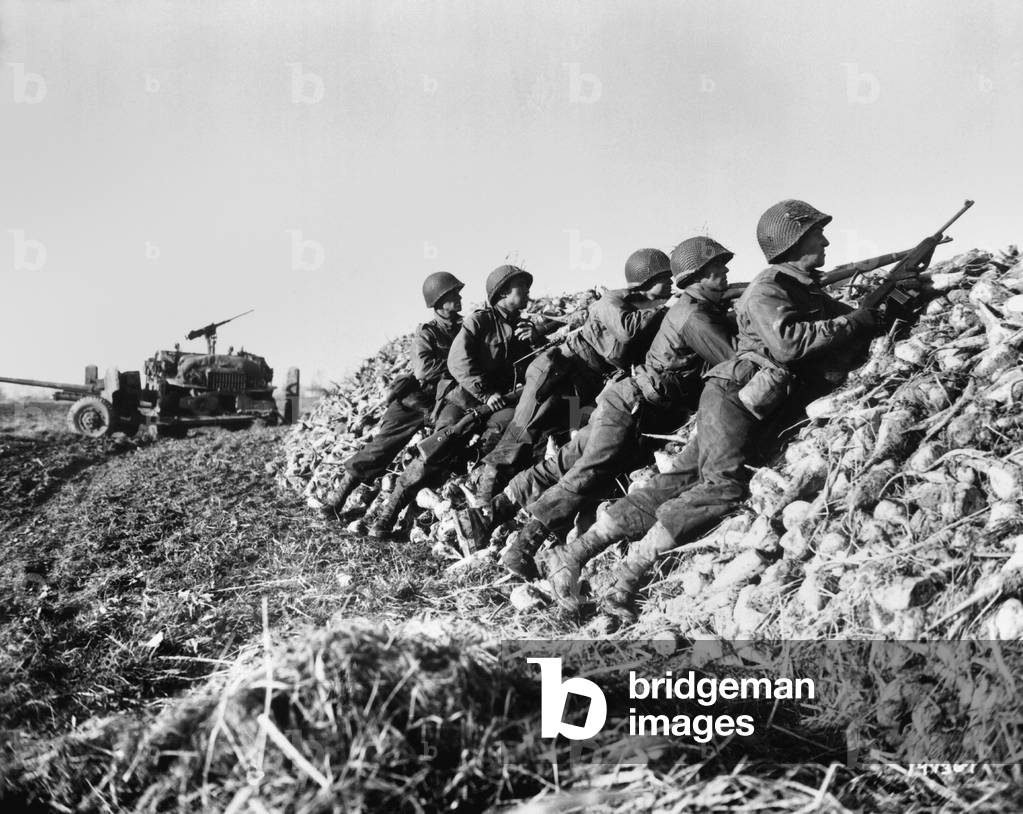 U.S. Infantry anti-tank crew fires on Germans who machine-gunned their vehicle. In the Netherlands, Nov. 4, 1944 during World War 2