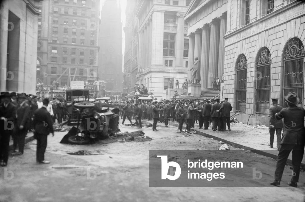 The Wall Street Bombing. Police, soldiers, and reporters at the scene of the Wall Street terrorist bombing, Sept. 16, 1920.The dead and injured people have been removed, leaving wrecked cars and a dead horse on Wall Street
