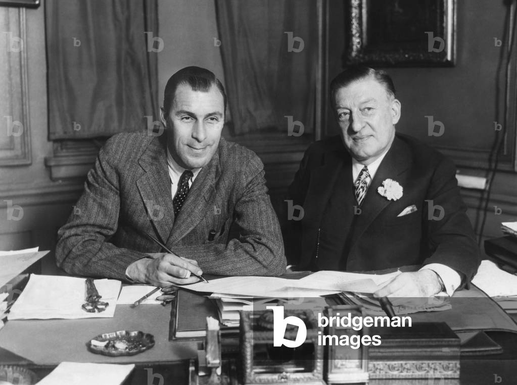 Tennis Champion, Bill Tilden, turns professional as he signs up for movies. William Tilden (left) signed with Metro Goldwyn Mayer for a series of short films dealing with tennis, thereby turning professional. Major Edward Bowes, Vice President of MGM closed the deal