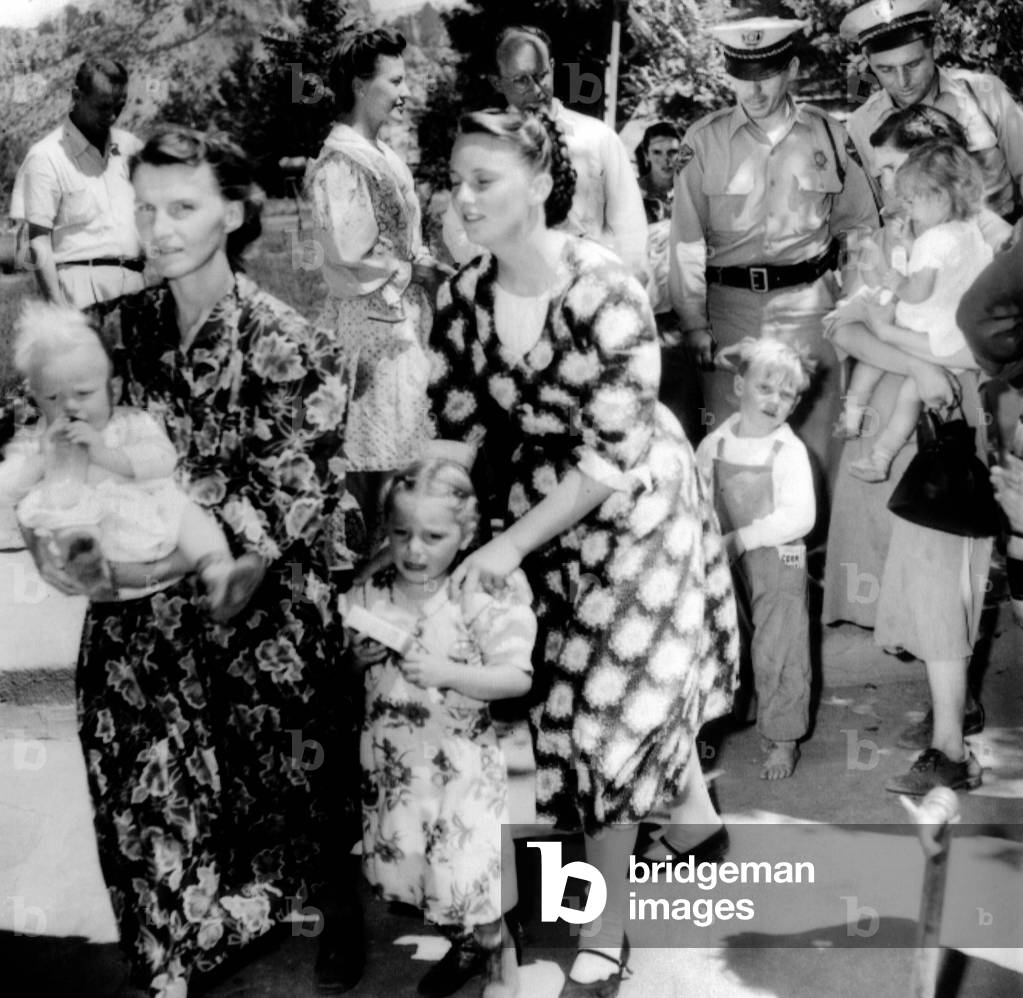 Women members of fundamentalist Mormons of the 'United Effort', under arrest for practicing polygamy, or plural marriage. The community of 400 lived in the town of Short Creek, Arizona and police arrested the entire town. July 26, 1953