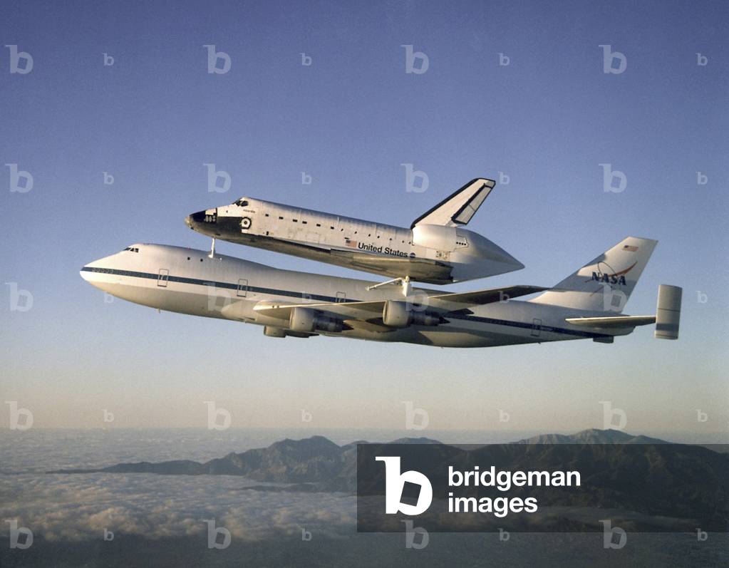 Space shuttle Atlantis atop the a customized 747 flies piggy back to the Kennedy Space Center after a ten month refurbishment. Sept. 1, 1998