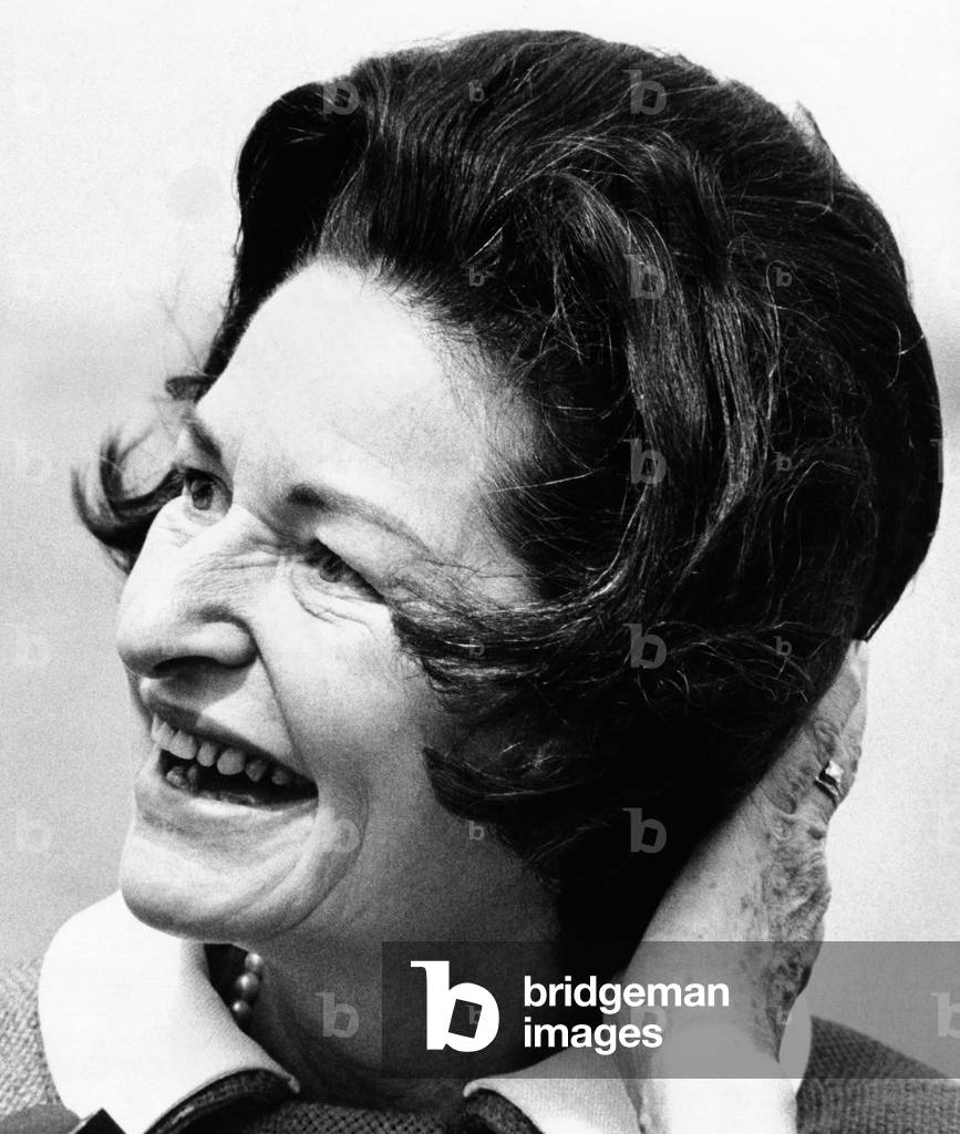 Lady Bird Johnson smiles as the wind disrupts her hairdo. She was visiting the Statue of Liberty to dedicate the American Museum of Immigration. May 17,1968