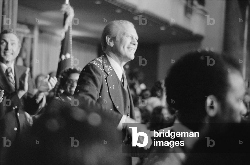 President Gerald Ford covered with confetti smiles at crowd after his arrival in Philadelphia for the 1st presidential debate with Jimmy Carter Sept. 23 1976