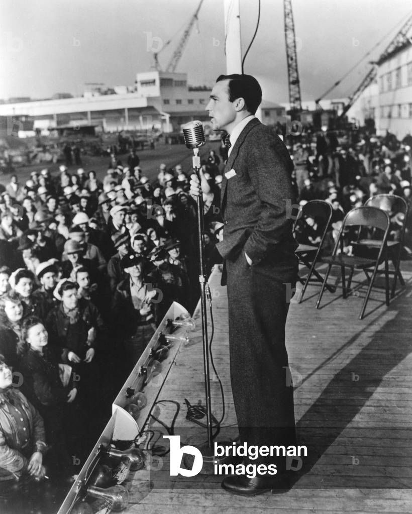 GENE KELLY sells war bonds during World War II, 1945