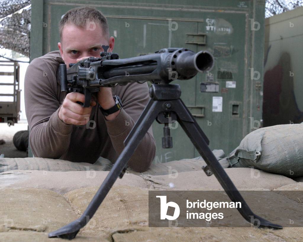 A US Marine takes aim with a German made MG42 machine gun in Ar Ramadi, Iraq. 11/29/2004: A US Marine takes aim with a German made MG42 machine gun in Ar Ramadi, Iraq. 11/29/2004