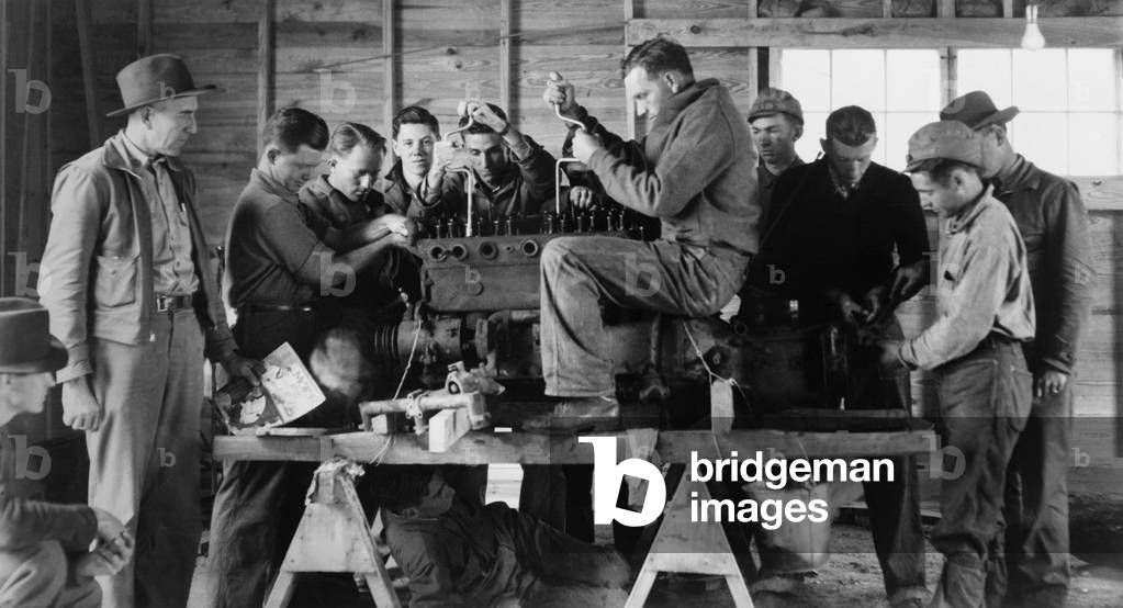 Civilian Conservation Corps (CCC) class learning about a gasoline motor. Arcadia, Louisiana, 1937-42.