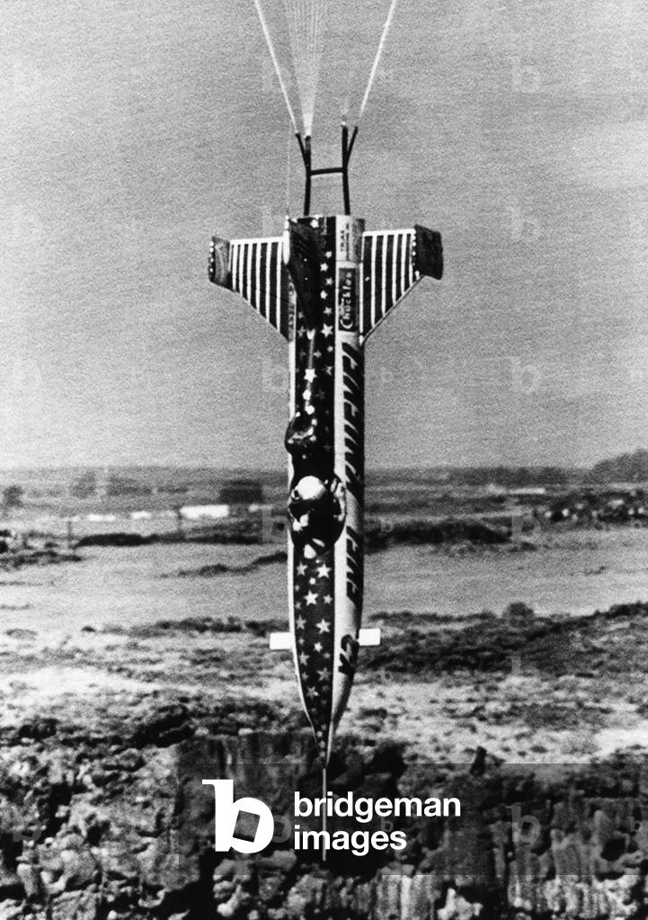 Evel Knievel and his rocket are suspended by parachute as he heads straight down into the Snake River Canyon, Twin Falls, Idaho, September 8, 1974.